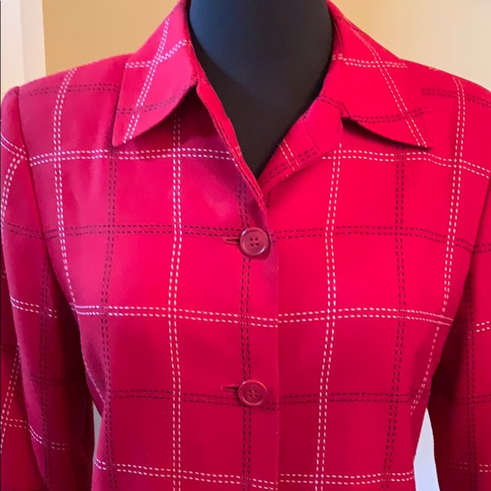 Red blazer with black and white heavy stitching